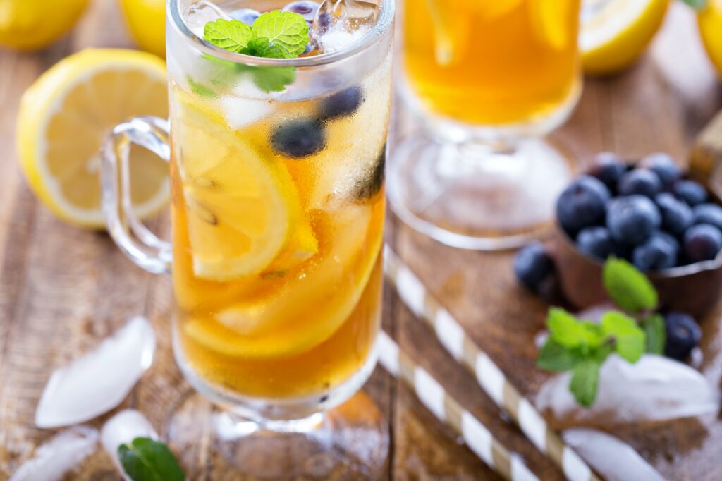 Iced tea with blueberries and lemon slices